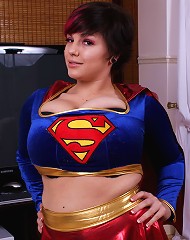 Big tit star Dors Feline squeezes her huge tits into her superwoman costume