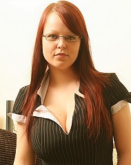 Sexy busty redhead secretary